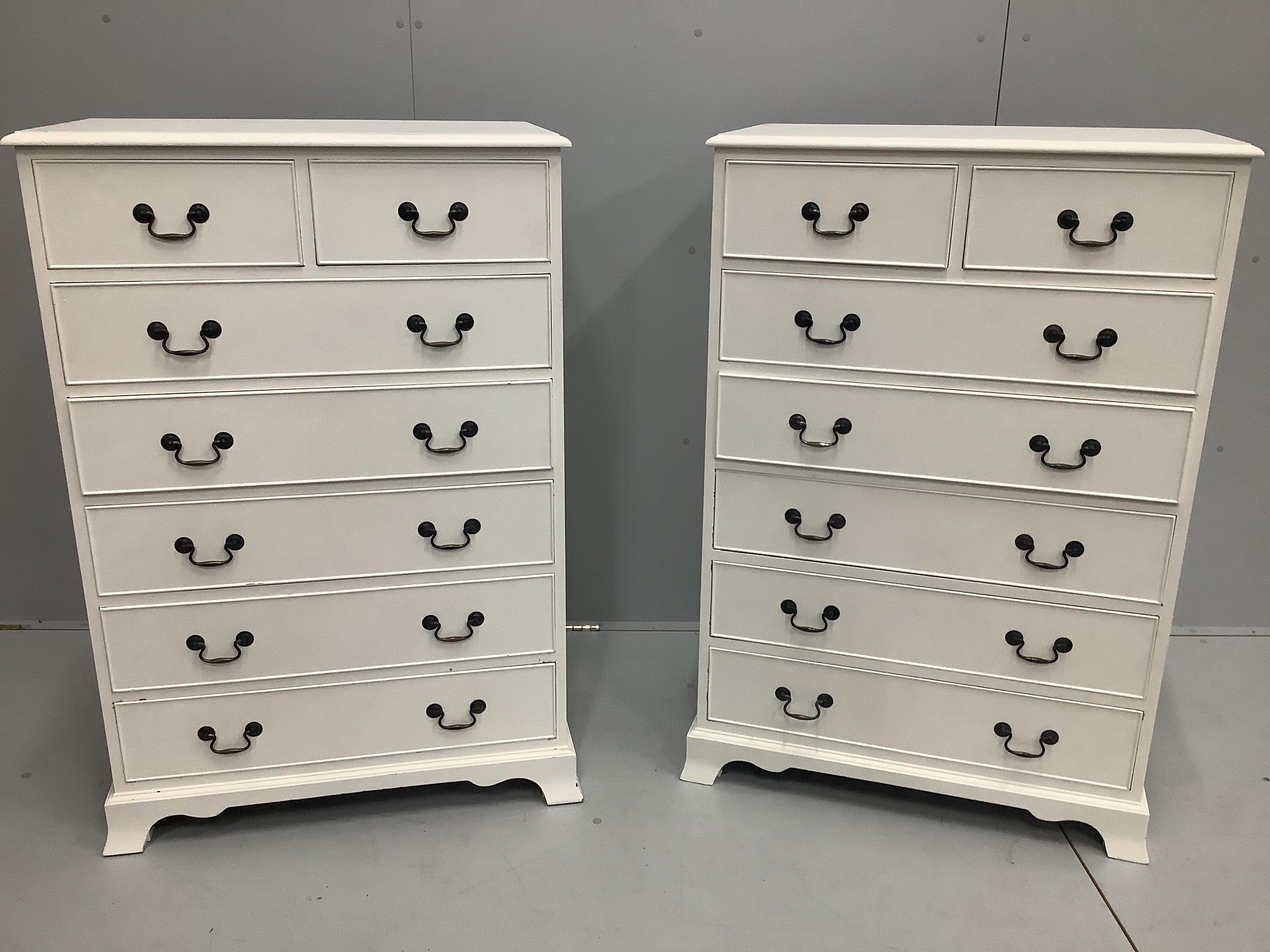 A pair of reproduction mahogany chests of seven drawers, later painted, width 79cm, depth 46cm, height 117cm